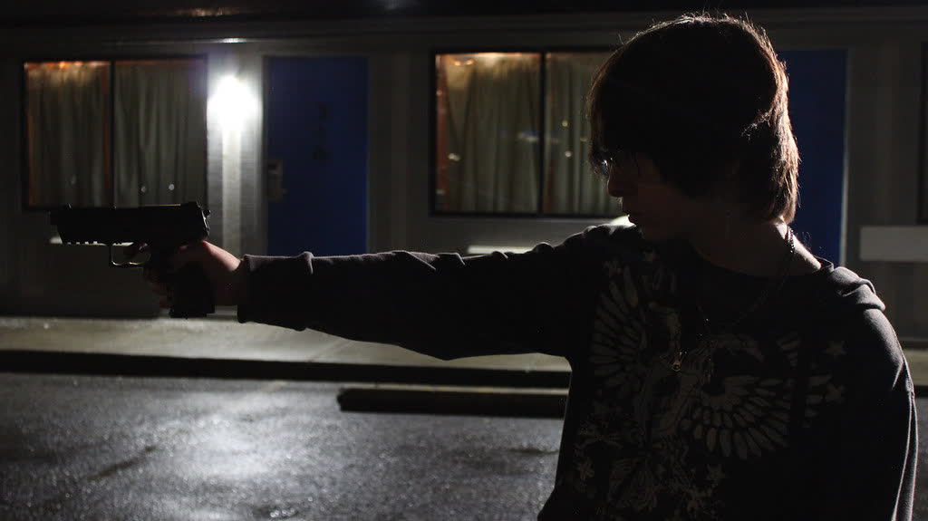Night shoot outside a motel, arm out toward the door
