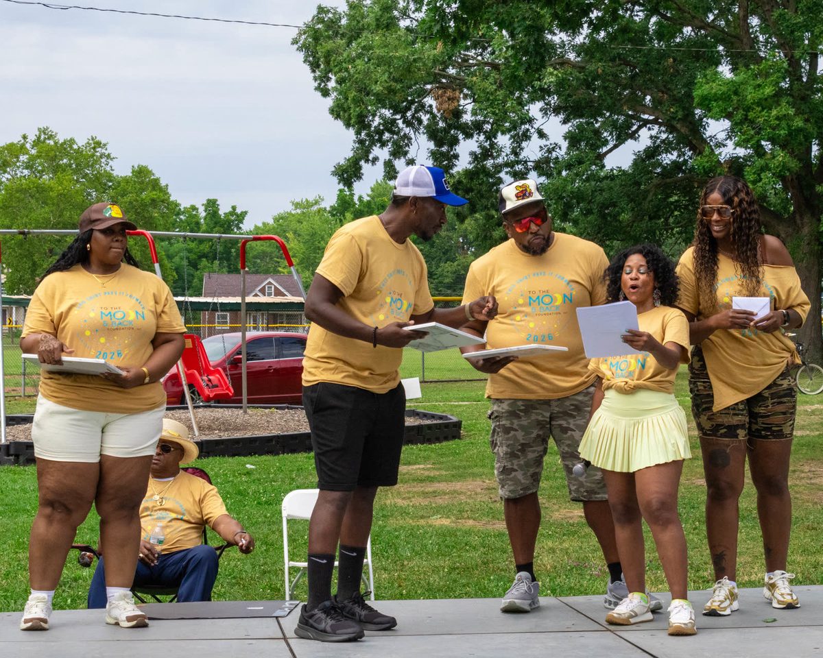 Organizers reading the program together