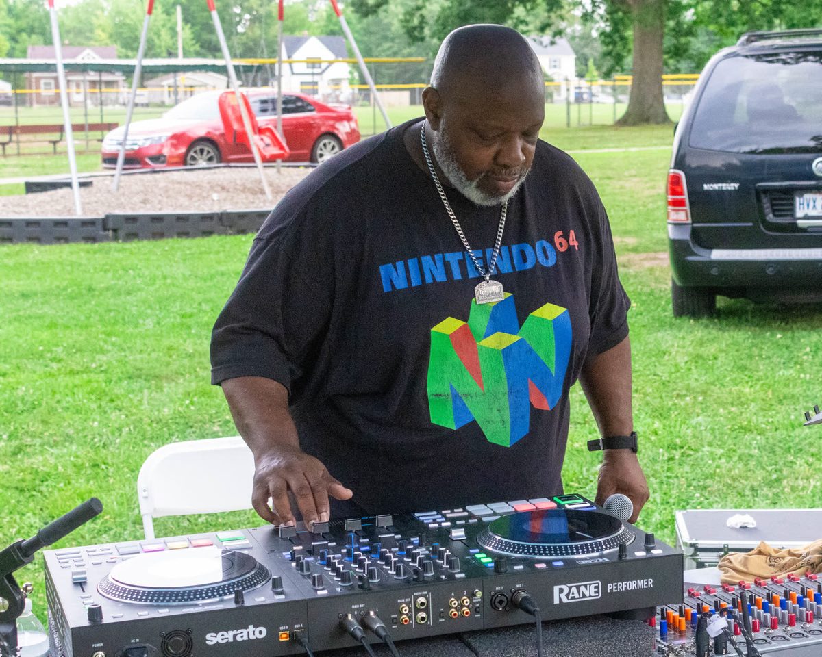 DJ working the decks at an outdoor event