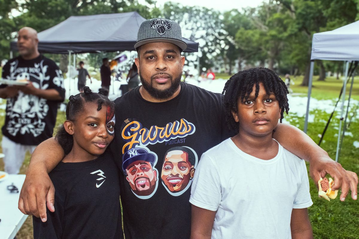Podcast crew and kids in Gurus shirts