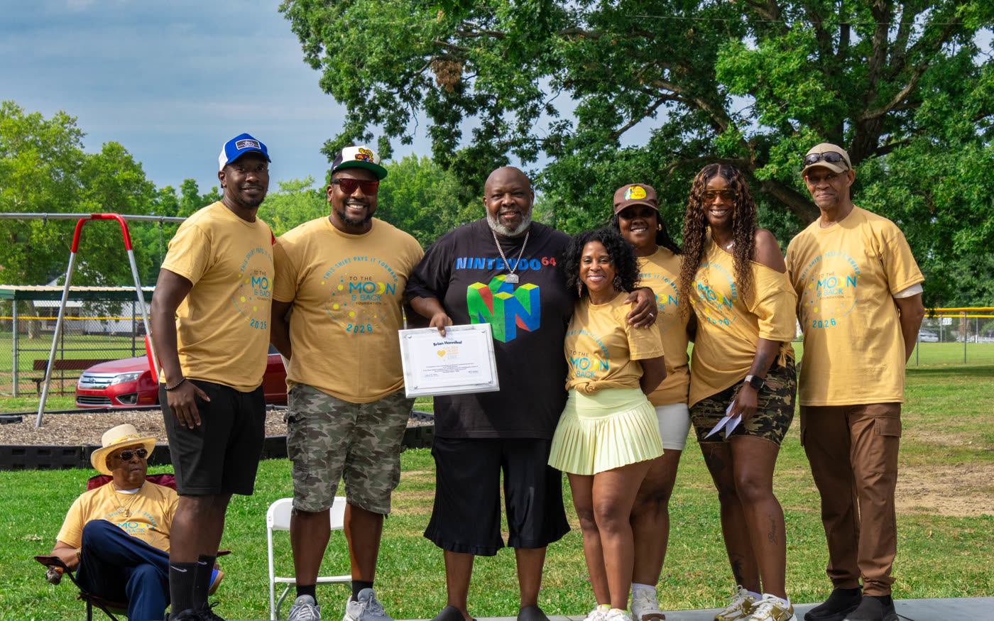 Award being presented at a community event covered by JS Media